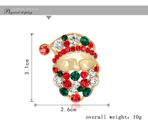 Detailed view of Santa Claus brooch with red and green crystals, 3.1cm x 2.6cm size guide