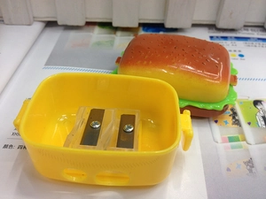 Detail view of the creative hamburger sharpener showing the internal dual-hole structure