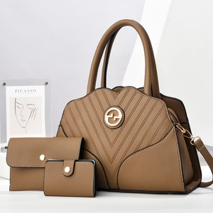 Brown lychee leather 3-piece bag set with tote, wallet, and purse in minimal setting