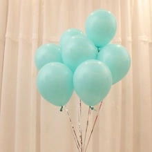 Close-up of tiffany blue latex balloons with shiny silver ribbons for party decoration