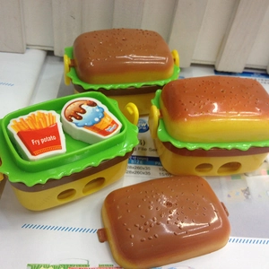 Hamburger pencil sharpener with French fry and ice cream erasers on a desk