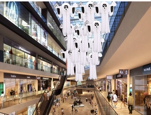 Macro shot of 3D paper Halloween ghost decorations hanging in a large mall atrium