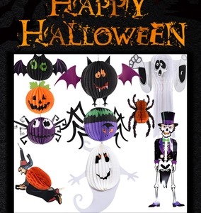 Flat lay of Halloween honeycomb paper decorations including bat, spider and pumpkin icons