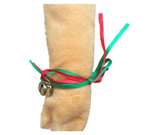 Close-up of plush reindeer antlers with red and green ribbons and a small gold bell