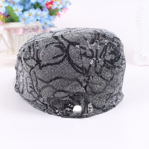 Silver glitter newsboy cap with black sequin rose floral patterns and metal button