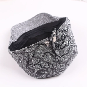 Silver glitter newsboy cap with black lace floral embroidery and metallic button detail