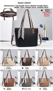 Detail view of large tote bag in pebbled leather with houndstooth scarf and seven colors