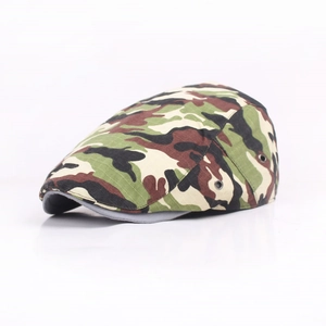 Close-up of jungle camouflage flat cap featuring metal side vents and cotton fabric