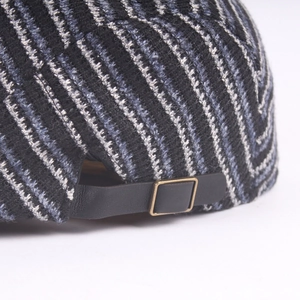 Striped knit beret hat with adjustable black leather strap and bronze metal buckle detail