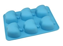 Detail of blue food-grade silicone mold featuring six apple-shaped ice cube cavities