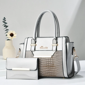 Elegant beige crocodile-embossed handbag set with matching long wallet and gold hardware