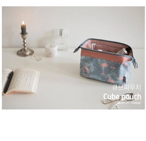 Macro shot of flamingo cube pouch interior with compartments for cosmetics and toiletries