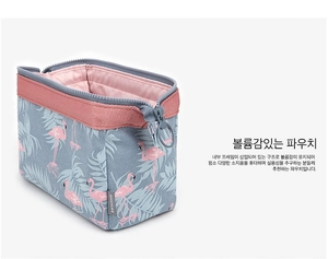 Detail of flamingo cosmetic bag showing its inner frame structure and pink zipper lining