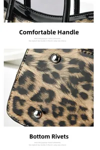 Détail du sac léopard avec poignée noire cylindrique et rivets de protection au fond