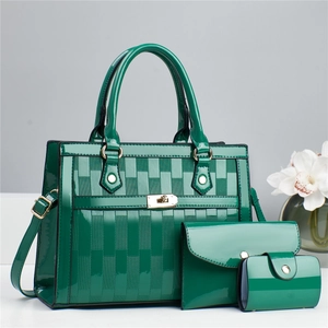 Detail view of dark green three-piece set with geometric embossed patent leather finish