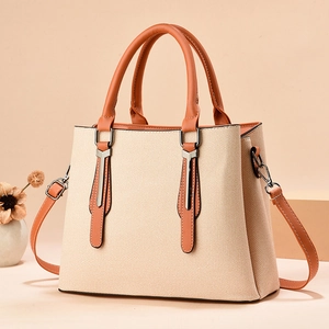 Sac à main élégant en toile beige avec poignées en cuir et bandoulière réglable