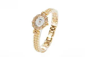 Detailed view of women's quartz watch featuring multi-row pearl strap and crystal bezel