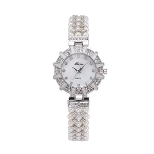 Elegant women's quartz watch featuring multi-row pearl strap and diamond-encrusted bezel