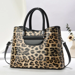 Classic leopard print handbag with glossy finish and black patent leather handles