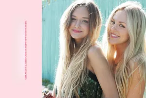 Outdoor lifestyle shot of vintage matte bee hair clips and fine chain necklaces