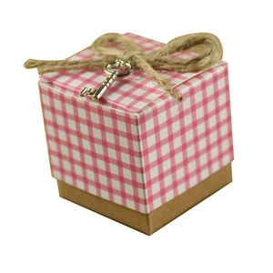 Pink and white checkered gift box lid with brown kraft base and silver key charm detail