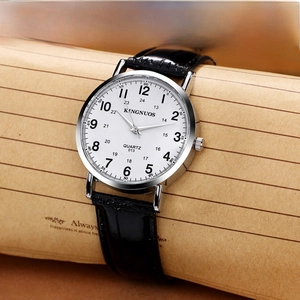 Classic silver quartz watch with white dial and black leather strap on a vintage background