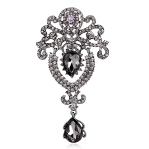Vintage crown brooch in dark metal with grey crystal rhinestones and pear-shaped gems