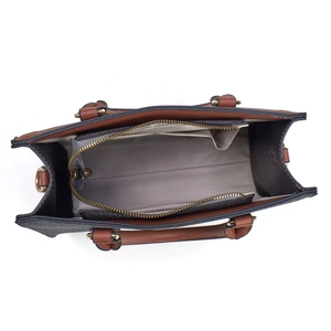 Top view showing large capacity interior with zipper compartment and herringbone lining