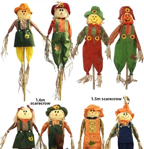Variety of colorful Halloween decorative scarecrows in different heights and styles