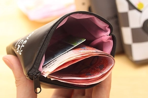 Close-up of black PU leather cat coin purse interior with pink lining and metal zipper