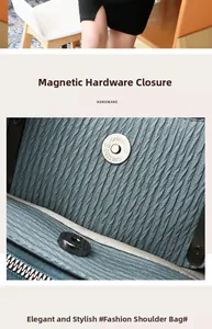 Detailed view of the magnetic hardware closure and pleated texture of the blue handbag