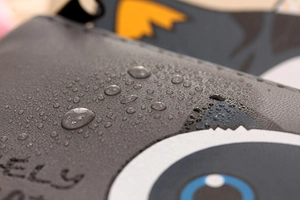 Waterproof PU leather detail of a cute cat coin purse showing water resistance