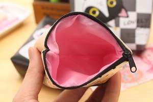 Detail of cute cat PU leather coin purse showing pink interior lining and zip closure