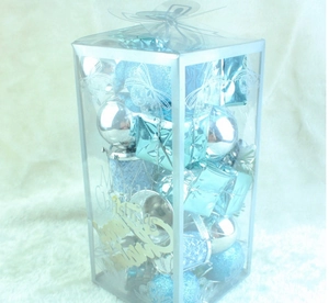 Detail view of 32-piece lake blue and silver Christmas tree ornament set in clear gift box