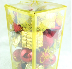 Detail of lake blue Christmas ball set in transparent packaging with Merry Christmas text