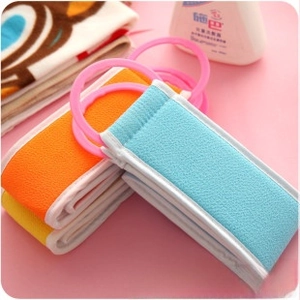 Close-up of long nylon bath towels in three colors with convenient round pulling rings