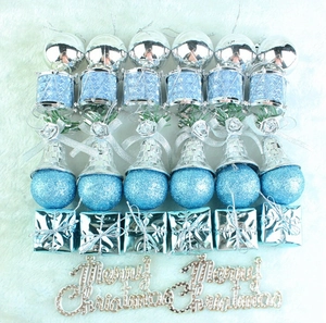 Detailed view of lake blue and silver Christmas tree ornaments in various shapes and textures