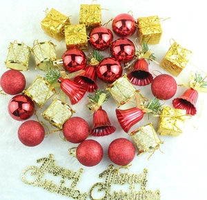 Flat lay of lake blue and gold Christmas ornaments on white plush background fabric