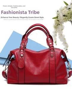Detail of red Boston bag featuring pebble leather texture and gold metal hardware hooks