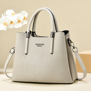 Beige pleated striped handbag with Fashion Queen logo and adjustable shoulder strap