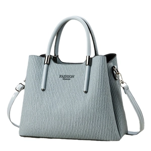 Light blue embossed leather tote bag for women with Fashion Queen lettering and silver hardware