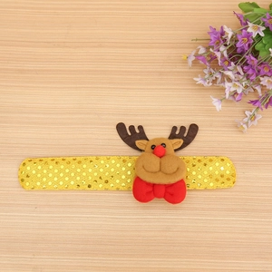 Detail of Christmas reindeer sequin snap bracelet with glowing LED and plush reindeer decor