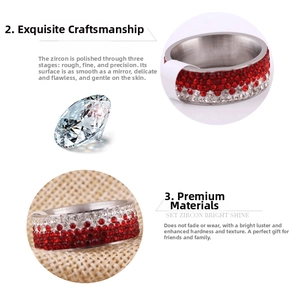 Detailed macro view of 8mm stainless steel ring with red and white cubic zirconia inlay