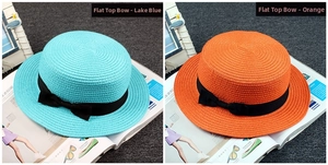 Flat top straw sun hats in blue and orange colors with black bow ribbon detail