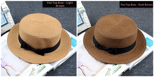 Flat top boater straw hats in light and dark khaki with elegant black bow ribbon details