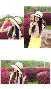 Close-up of foldable straw sun hat with black ribbon bow for women beach vacation
