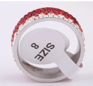 Macro view of 8mm stainless steel ring with red and white pave-set rhinestones