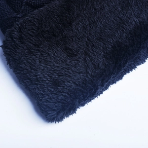 Close-up of the thick black fleece lining providing extra warmth for winter knit hats
