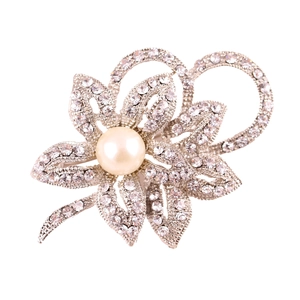 Silver flower brooch featuring a large center pearl and sparkling rhinestone petals