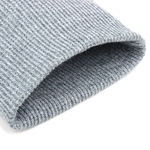 Close-up of grey ribbed knit texture and soft fabric edge of the outdoor winter beanie